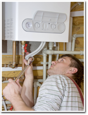 plumber repairing boiler